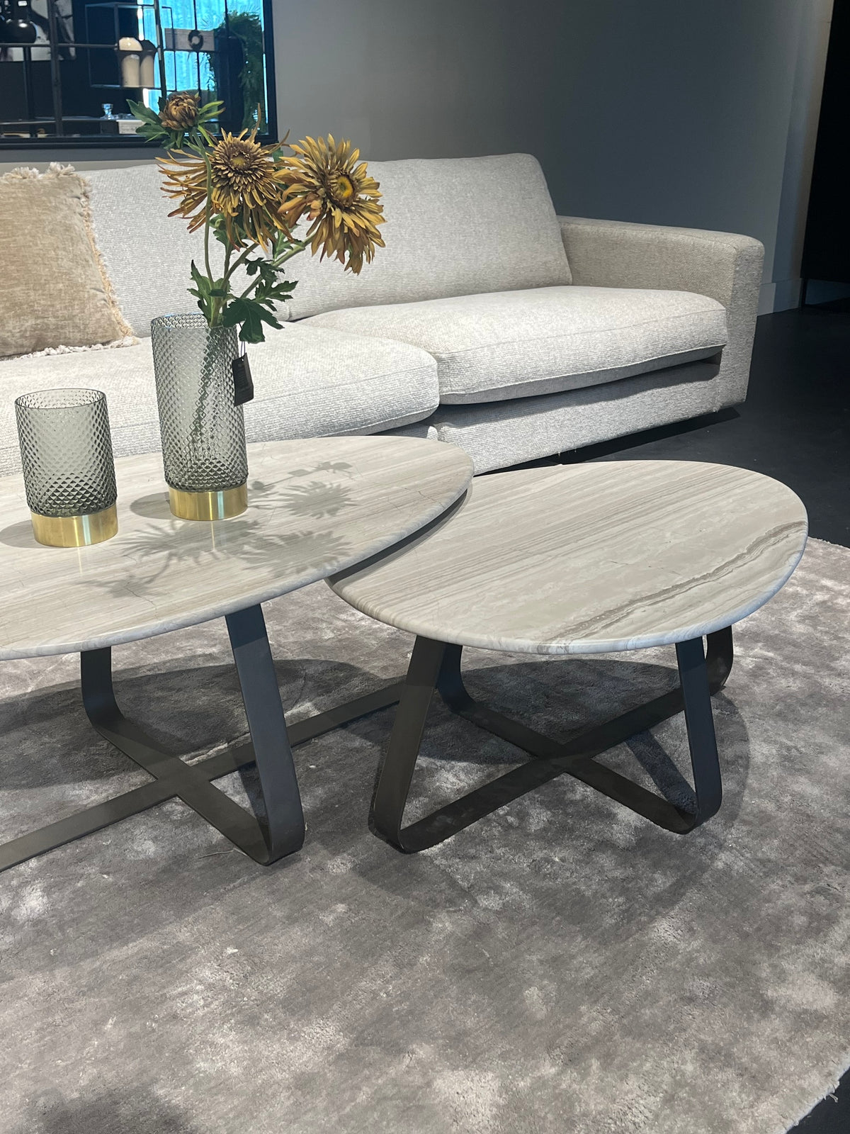 Muka white marble coffee table with dark grey base, tall