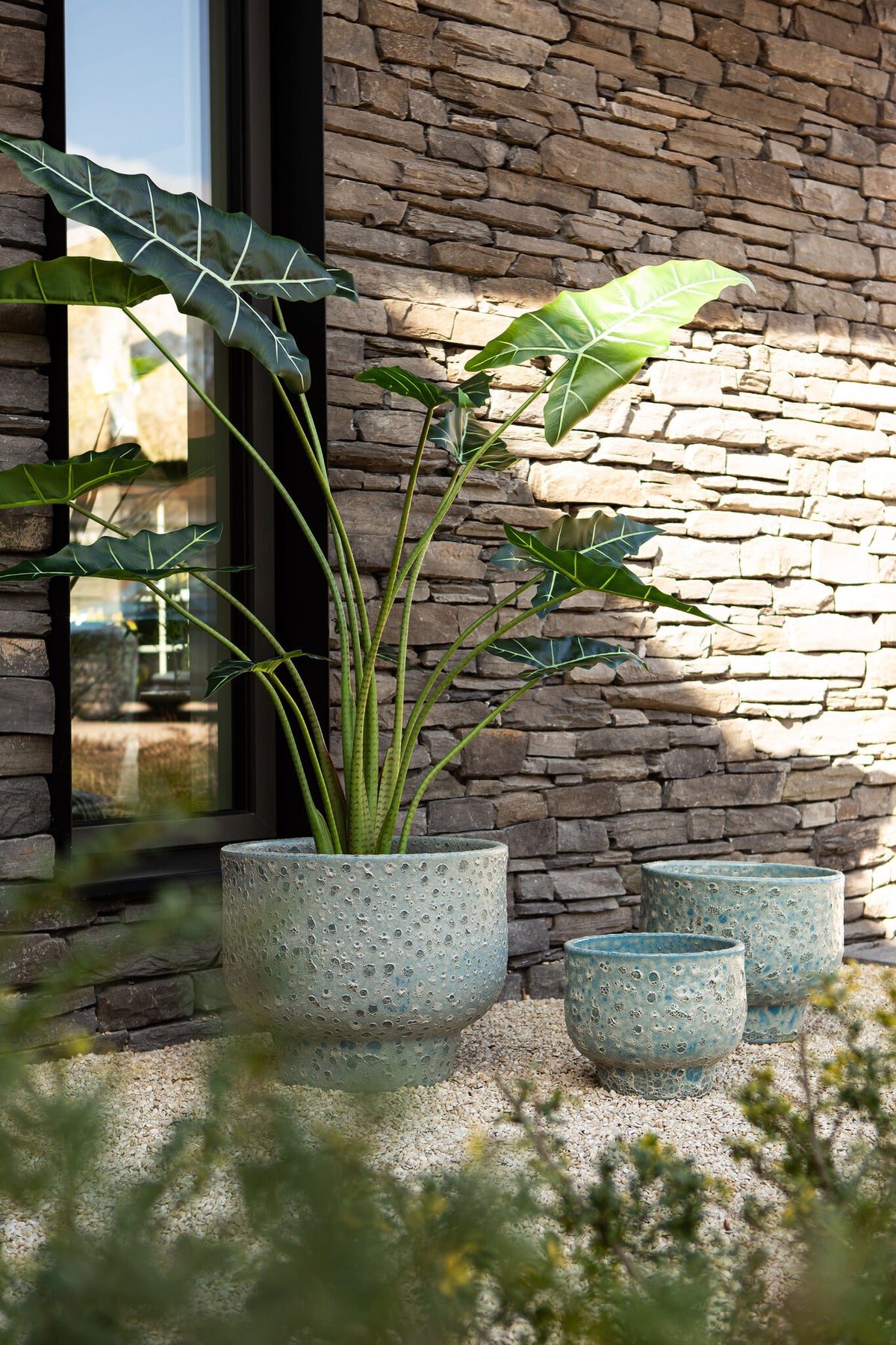 Sanish blue glazed ceramic pot on textured foot