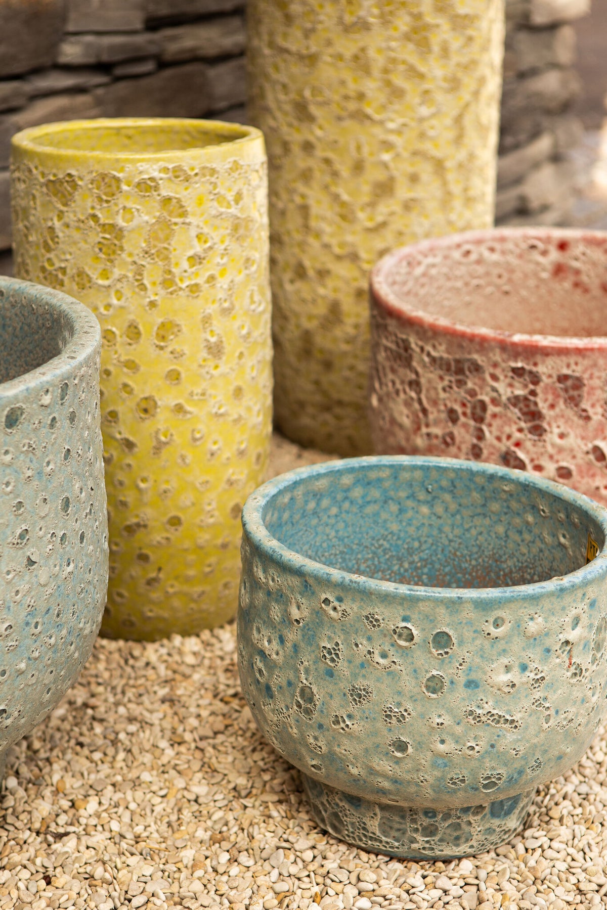 Sanish red glazed ceramic pot on textured foot