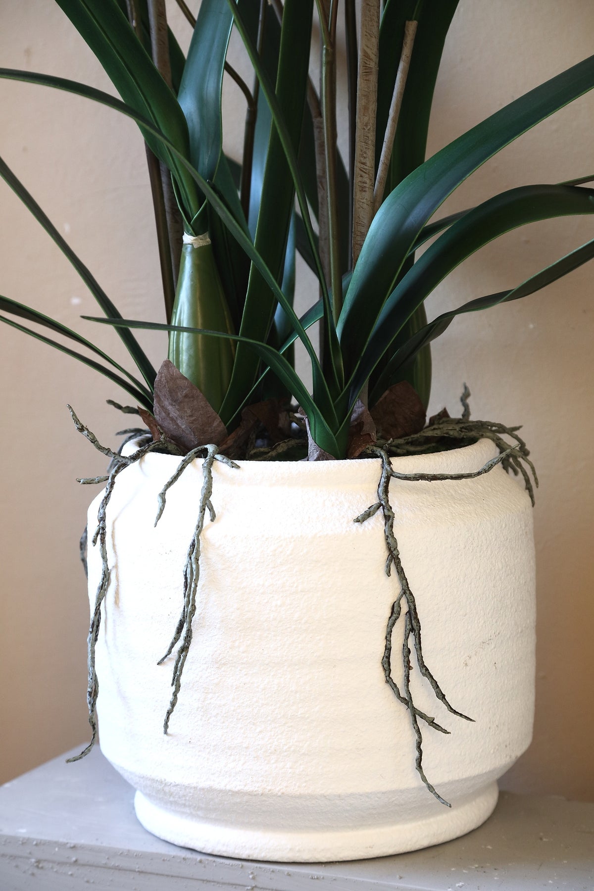 Orchid faux orchid in a ceramic pot, green