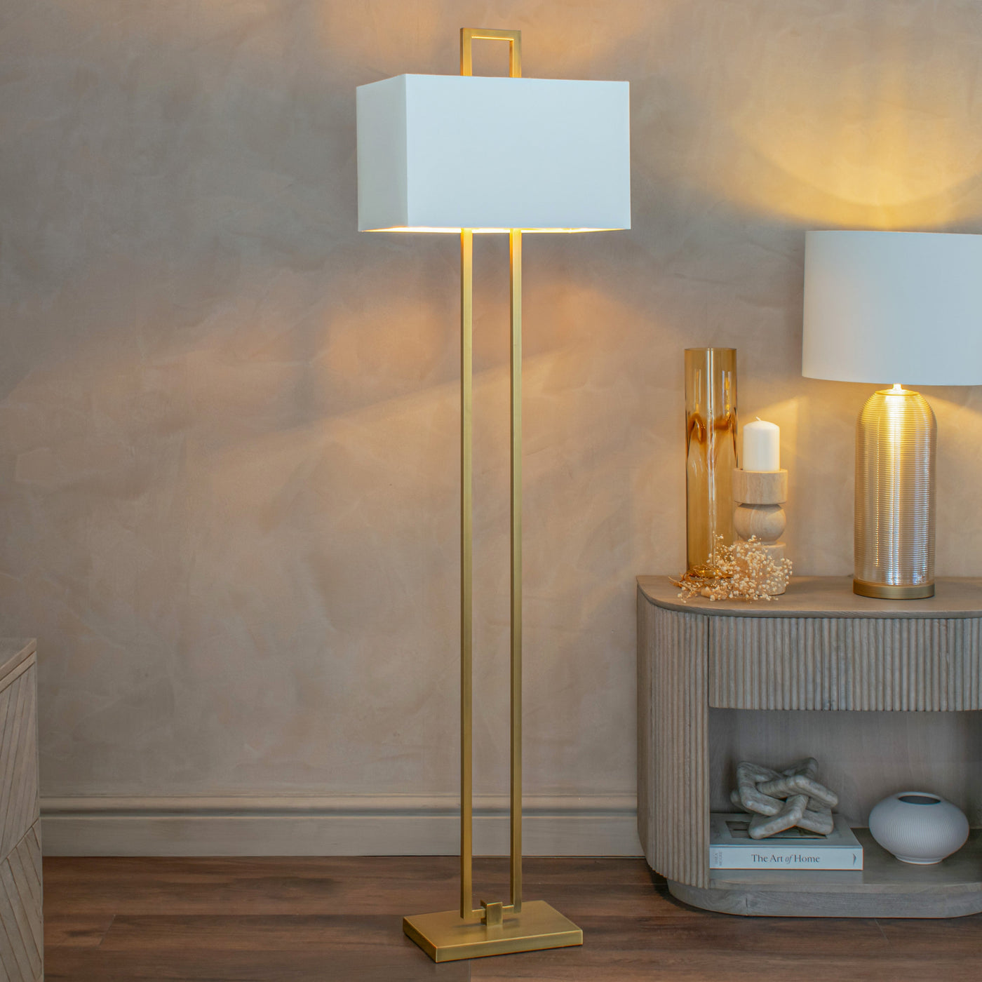 Brass floor lamp in a warm styled corner — Conpanna Living