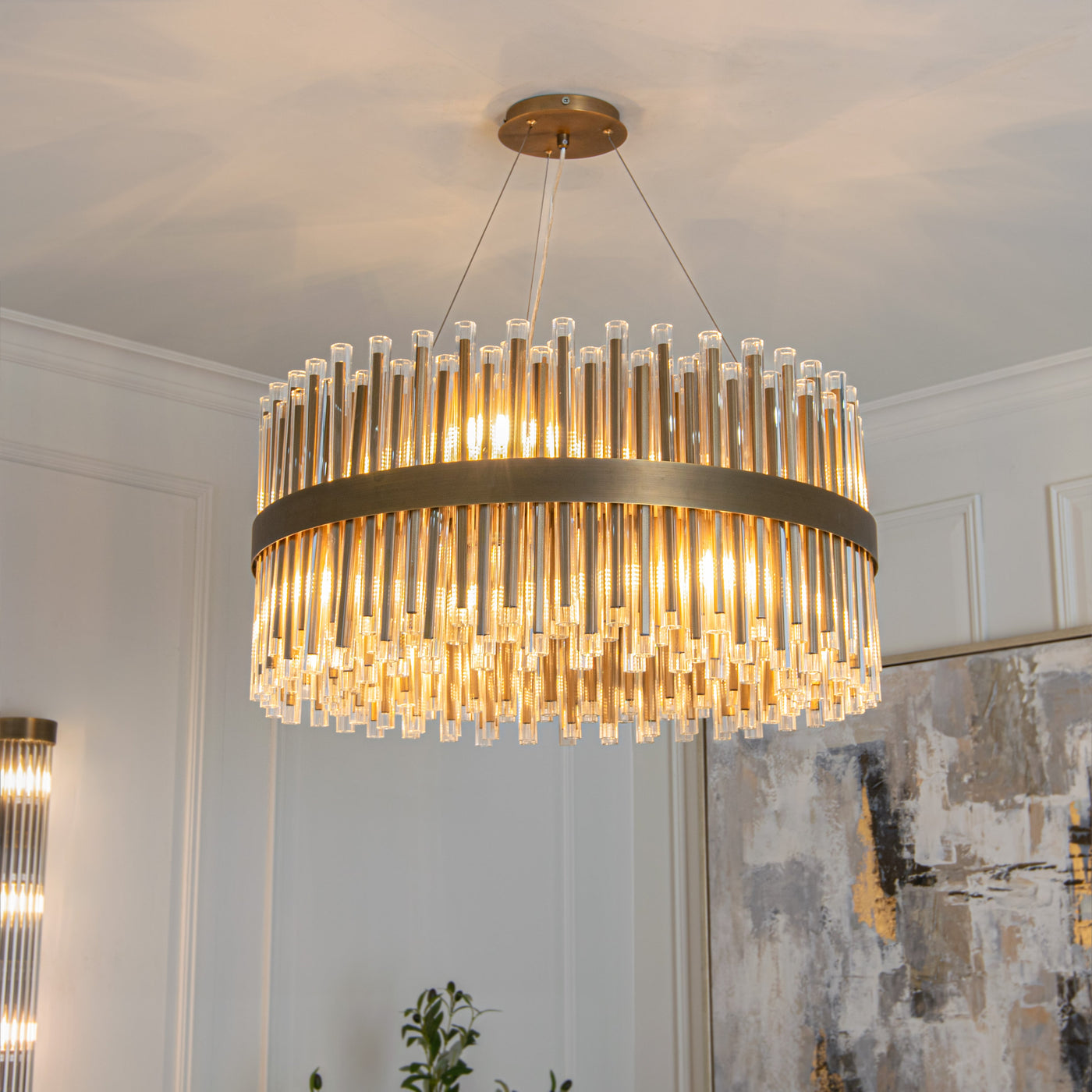 Designer crystal-rod chandelier in a panelled room — Conpanna Living