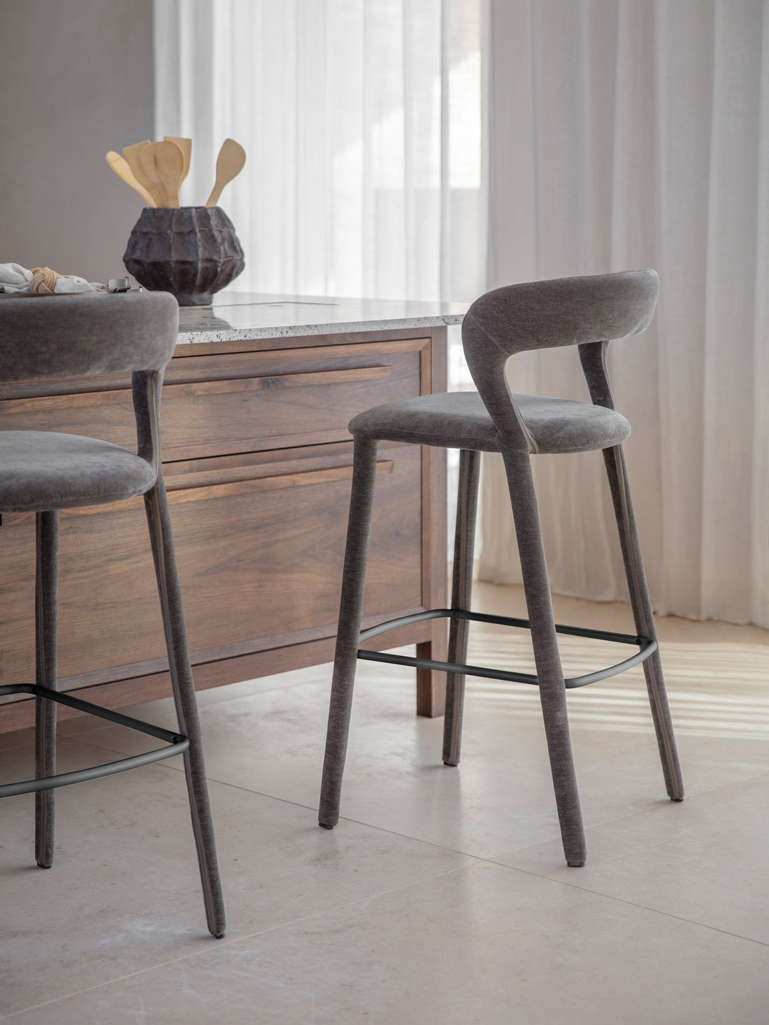 Black leather and oak bar stool by a marble table — Conpanna Living