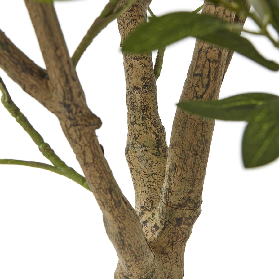 Faux olive tree styled in an interior