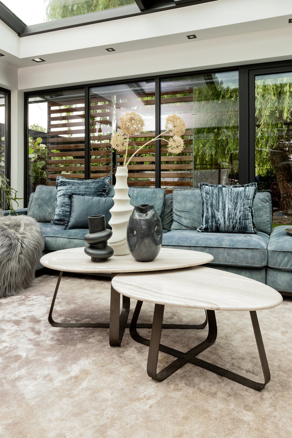 Muka white marble coffee table with dark grey base, tall