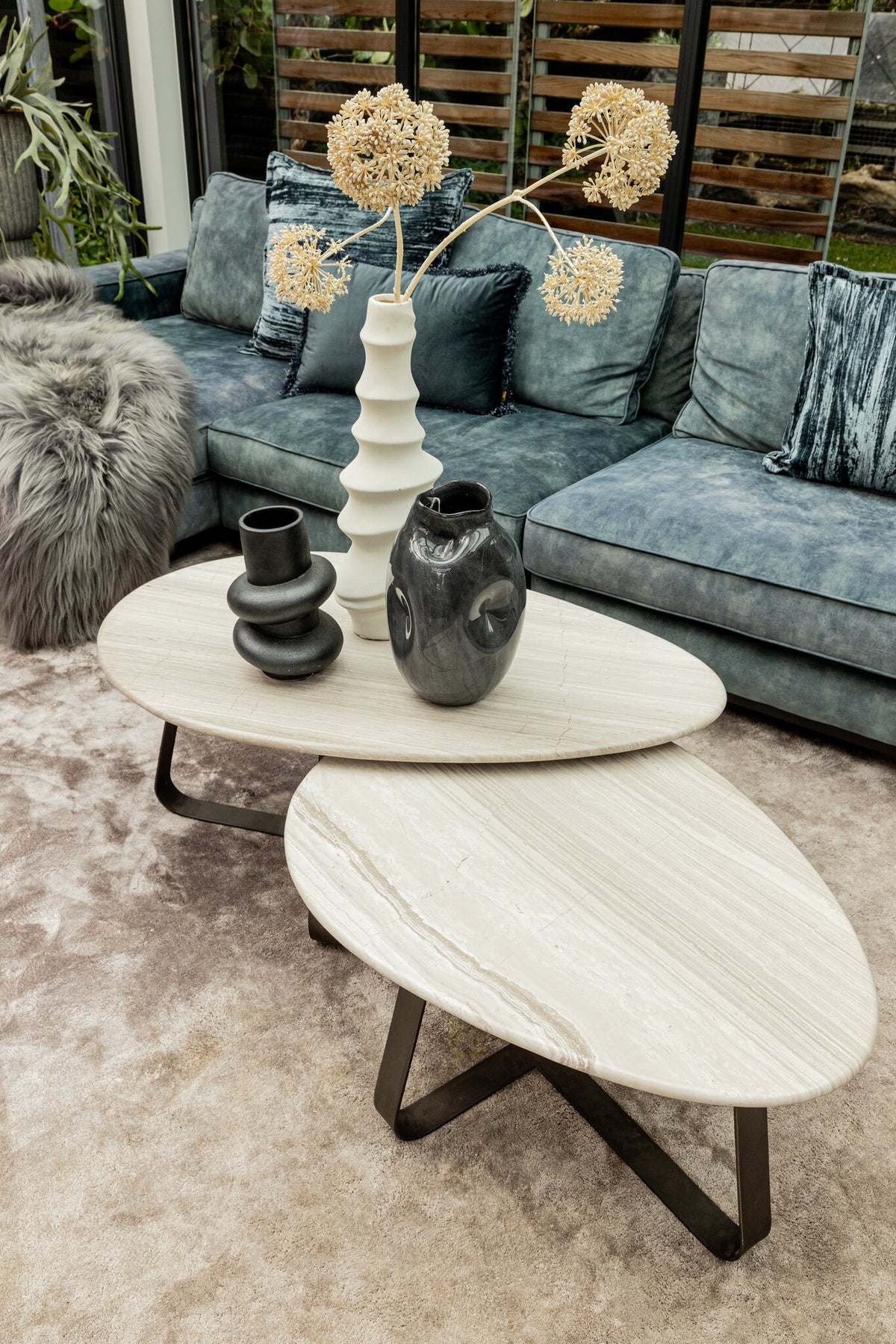 Muka white marble coffee table with dark grey base, tall