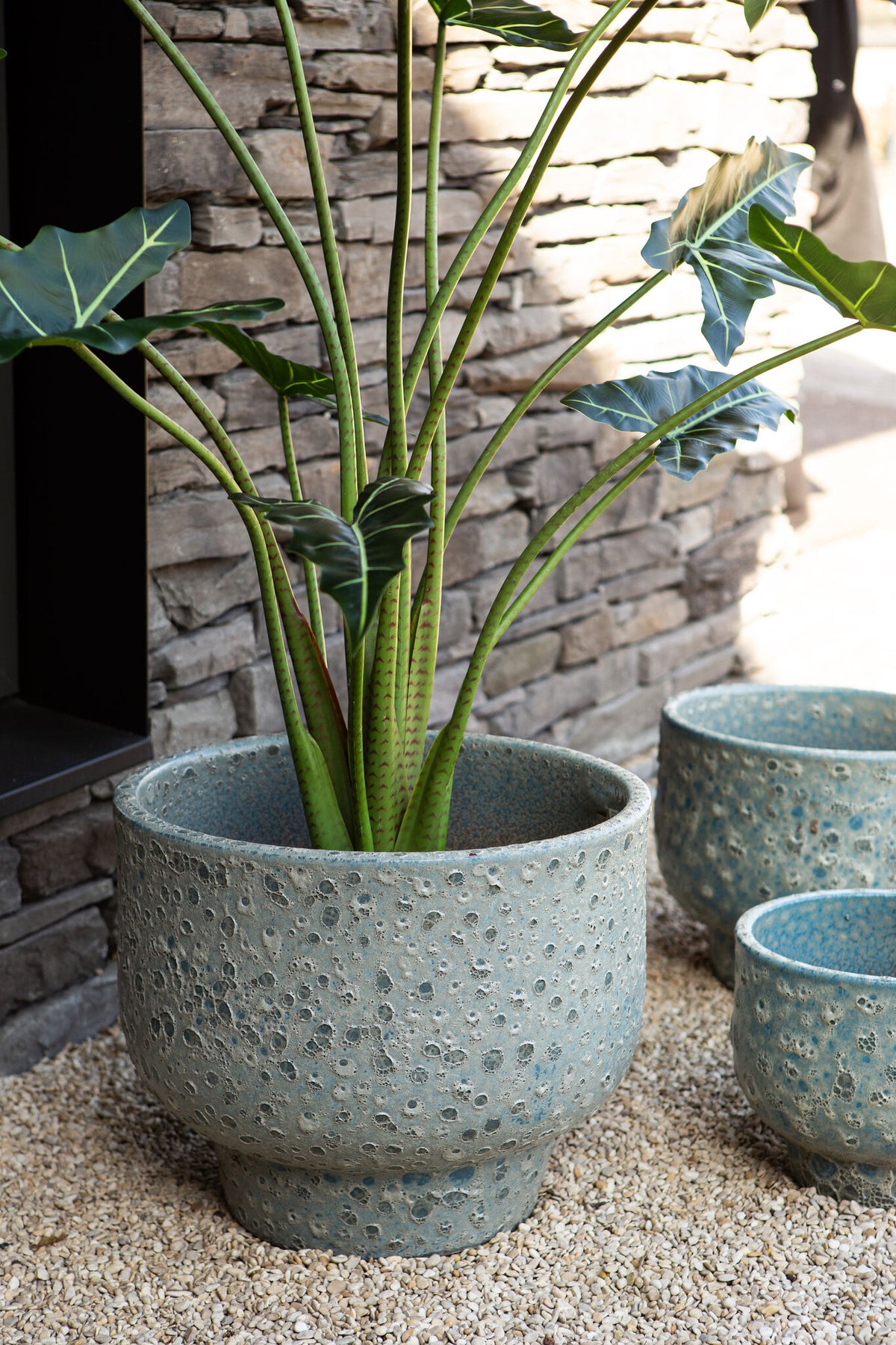 Sanish blue glazed ceramic pot on textured foot
