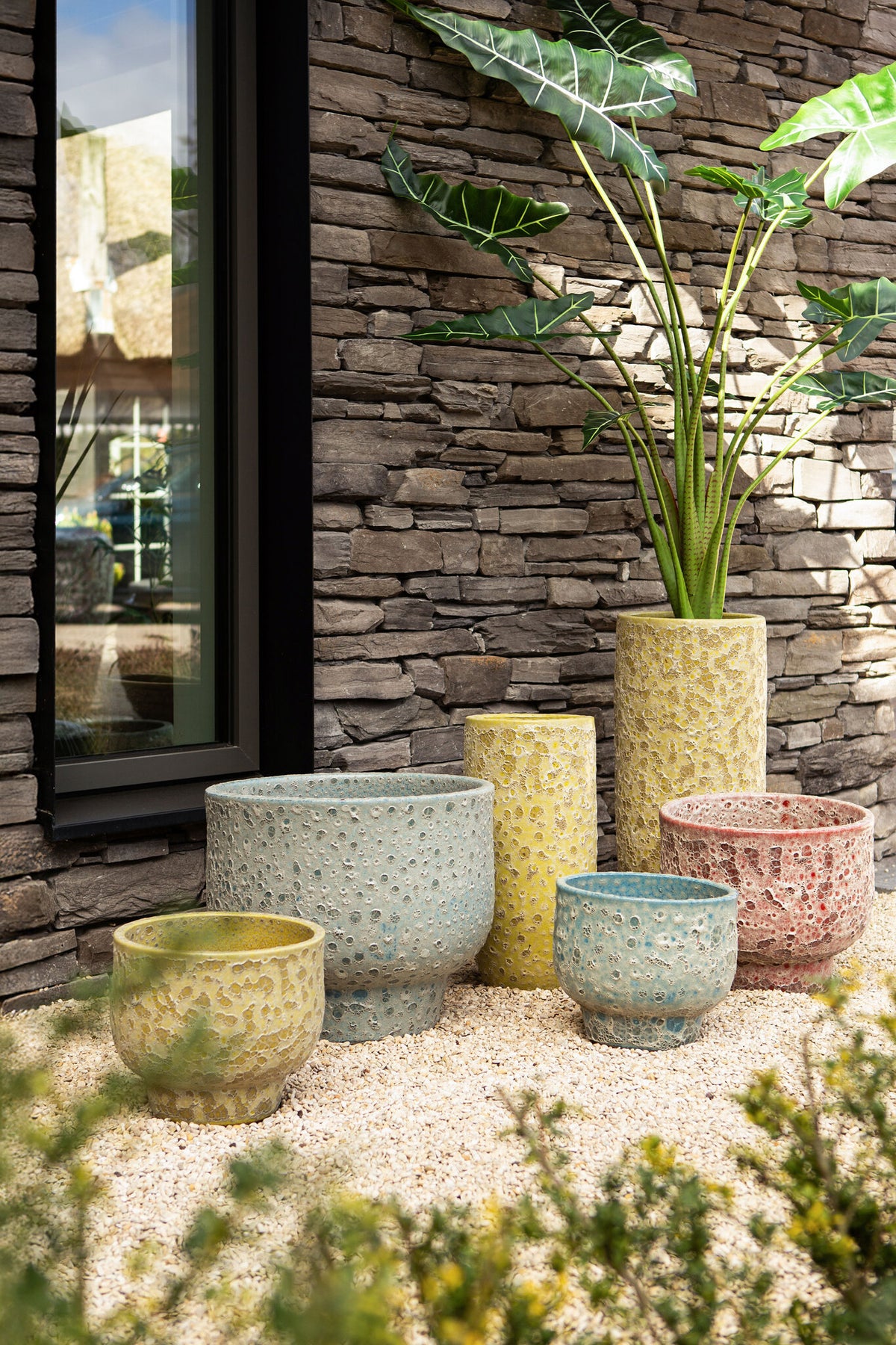 Sanish blue glazed ceramic pot on textured foot