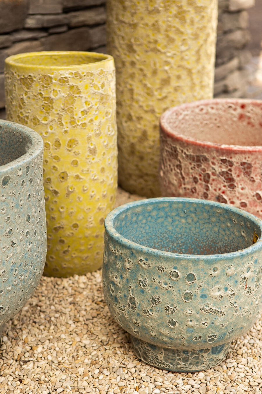 Sanish red glazed ceramic pot on textured foot