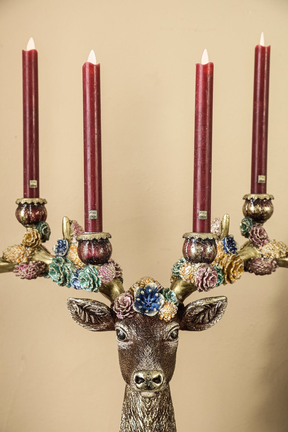 Deane burgundy polyresin reindeer candle holder with flowers