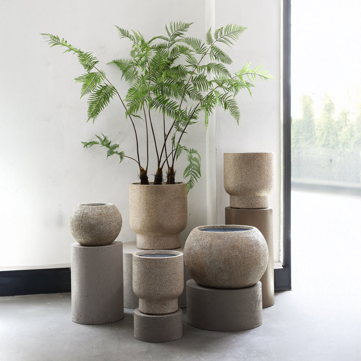 Nihara beige fibre cement ball planters, set of two