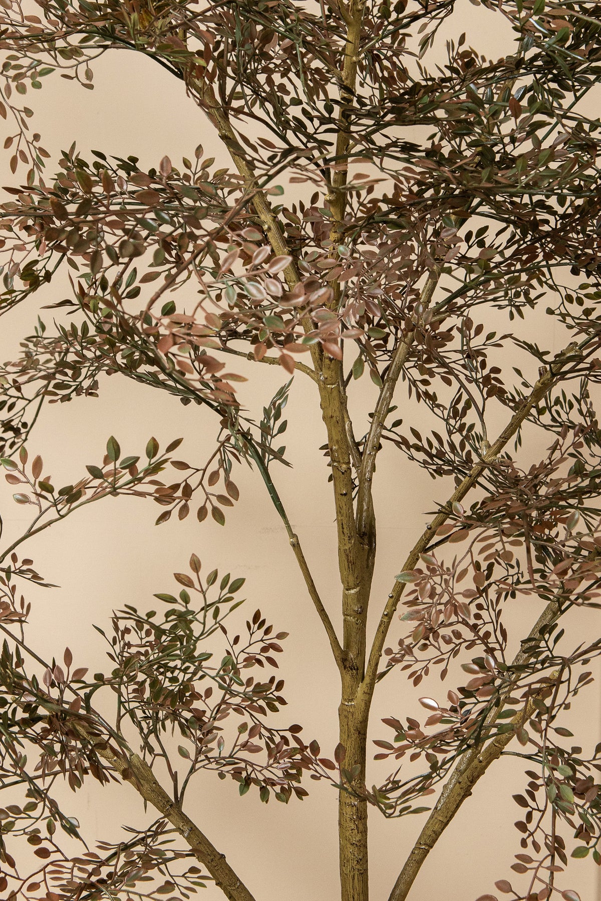 Faux small-leaf tree in weighted pot