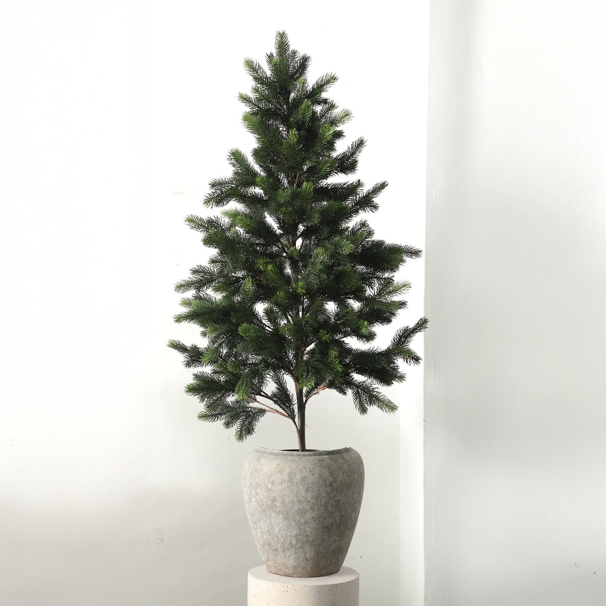 Charlla green faux pine tree in black pot, large