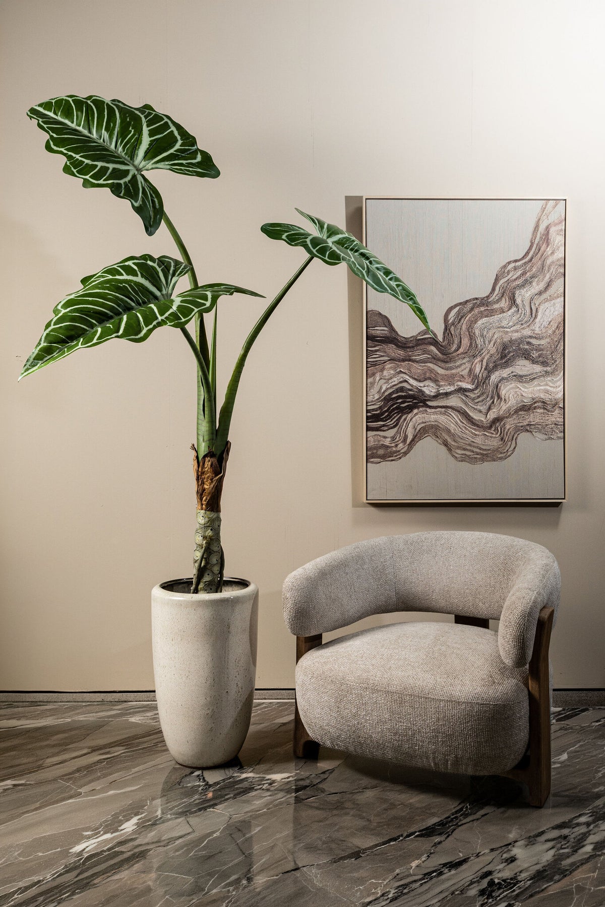 Leaves faux green plant in a black pot