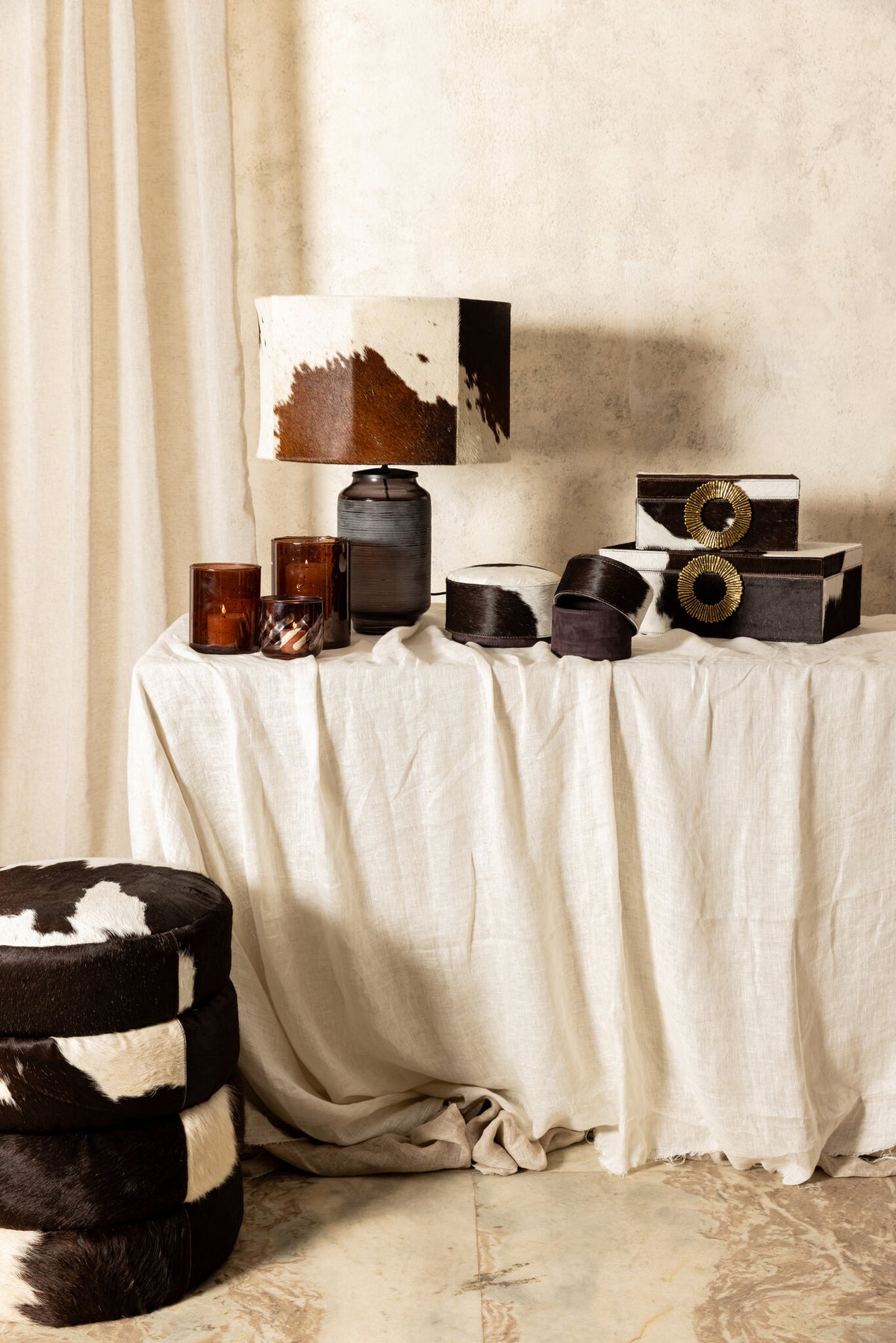 Royan dark brown cowhide storage pouffe, round