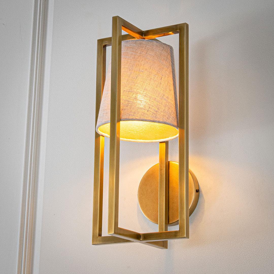 Hurricane Wall Light in brushed gold and off-white — front view