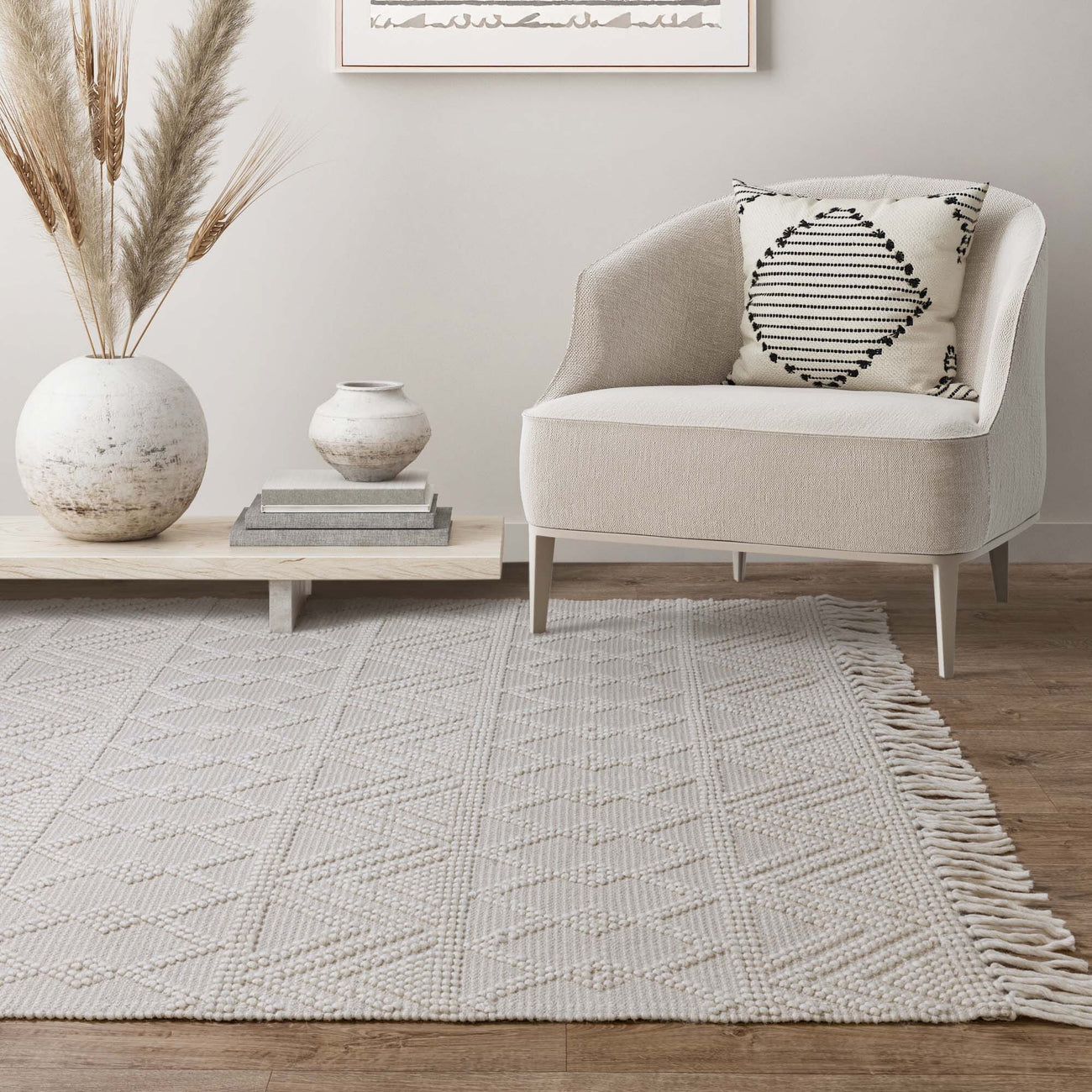 Asra Ivory hand-woven wool flatweave rug on a white background