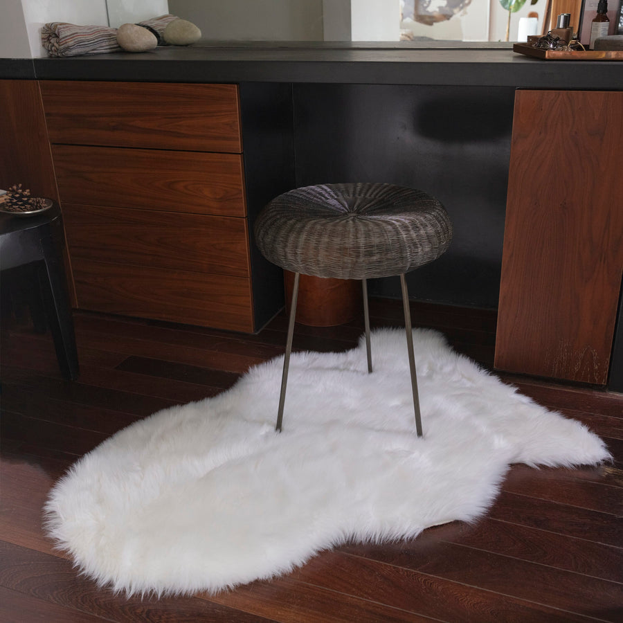 Auckland White faux sheepskin rug on a white background