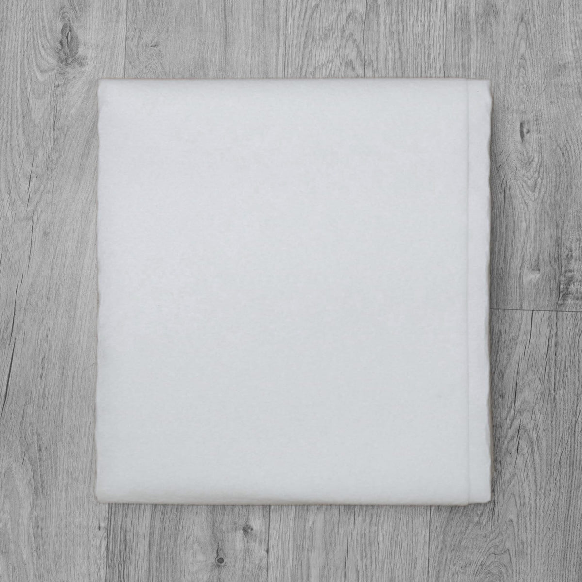 Essential anti-slip rug underlay laid flat, shown beneath a rug