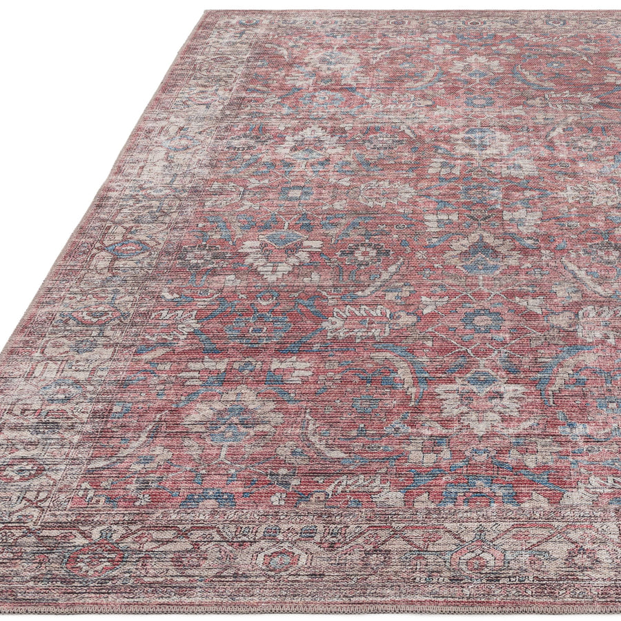 Kaya Mona washable flatweave rug with faded floral pattern on white background