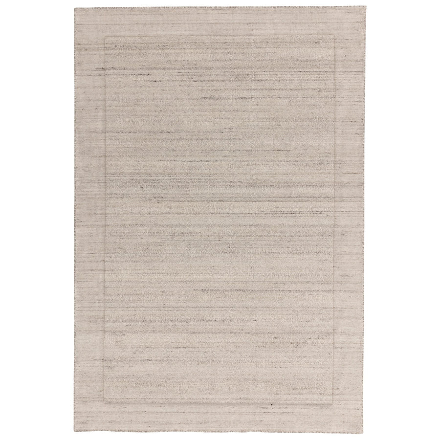Larson Ivory wool rug on white background, full view showing staggered border detail