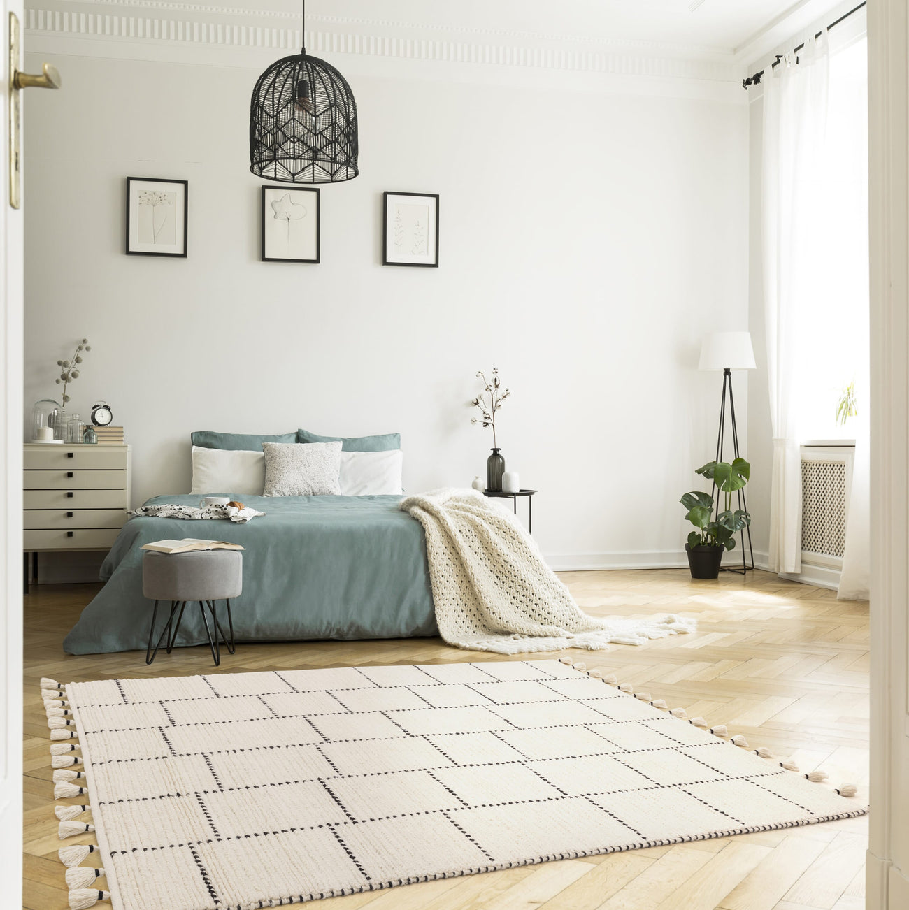 Nepal Cream Black Tile wool rug on plain background