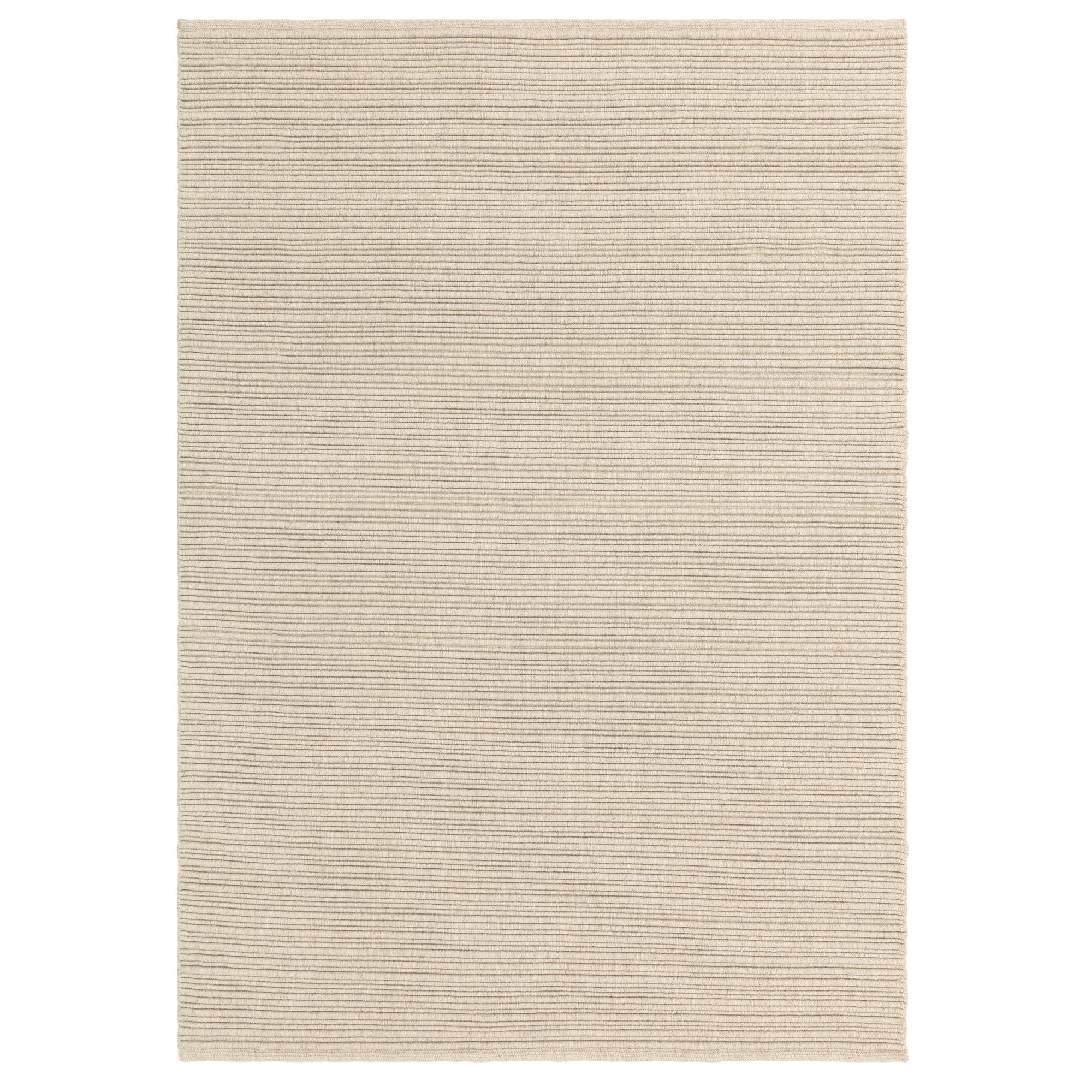 Ravine Ivory ribbed wool rug on a white background showing full texture and looped weave