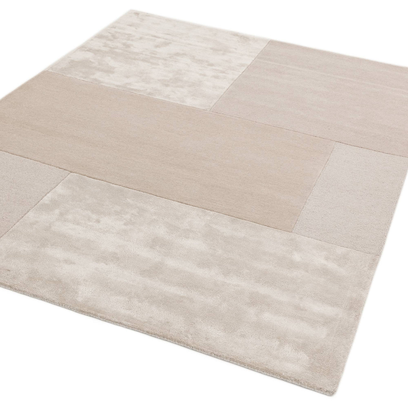 Tate Ivory hand-carved geometric wool rug on white background