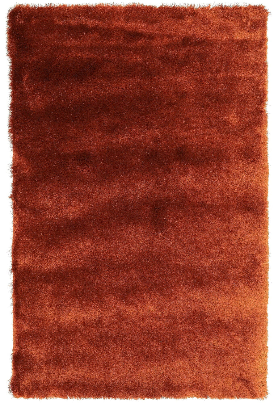 Whisper Rust silky shaggy rug on white background